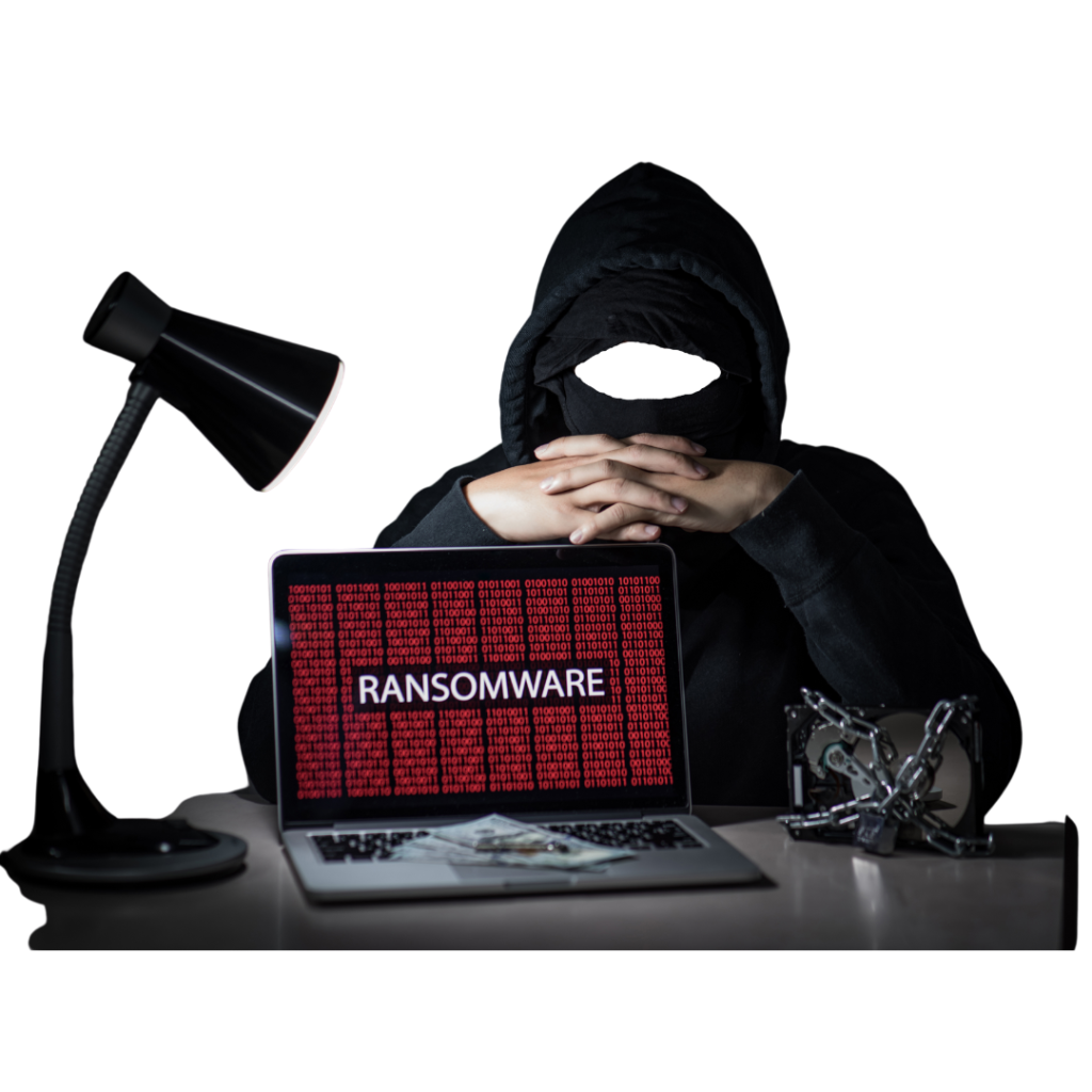 Esperto di sicurezza offensiva Hacker per la sicurezza offensiva dietro ad uno schermo con la scritta ransomware illuminato da una lampada da tavolo